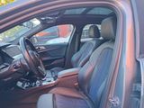 the interior of a car with leather seats and a steering wheel