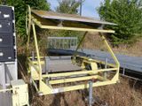 a yellow trailer that has a solar panel on top of it