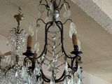 a chandelier hanging from the ceiling in a room
