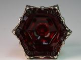 an image of a red glass bowl on a white surface