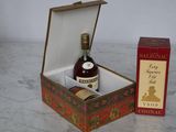 a box with a bottle of liquor in it and a box with a bottle of wine in it