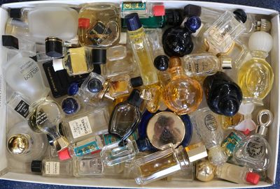 a white box filled with lots of different types of perfumes