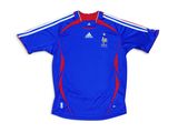 a blue shirt with a red and white stripe on the chest