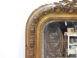 a mirror that is sitting on the wall in the room