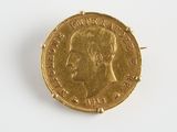 l'image d'une pièce d'or sur laquelle figure le visage d'un homme