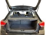 the back of a car with the trunk open and the seats folded down
