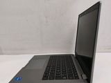 a laptop that is sitting on a white surface