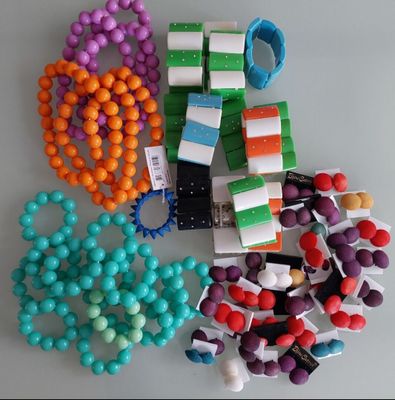 a lot of beads and bracelets on a table