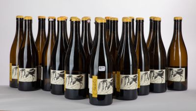 six bottles of wine are lined up in a row on a table