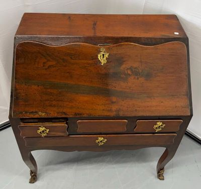 a small wooden desk with two drawers on it