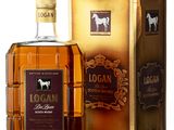 the bottle of logan is next to a gold box