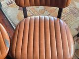 three chairs that are sitting on a rug in a room