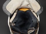 hat on top of a bucket on a black surface