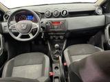 the interior of a small car with a steering wheel and dashboard controls