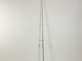 a black and white photo of a broom and a pole in a room