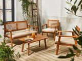 une photo d'un ensemble de mobilier de jardin en bois posé sur une terrasse en bois