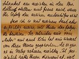 lettre manuscrite écrite à l'encre noire sur une feuille de papier