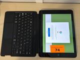 a laptop and a tablet sitting on a desk next to each other