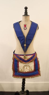 an image of a mannequin with a blue sash and a red sash