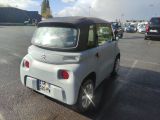 a small car that is parked in a parking lot