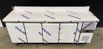 a group of four freezers sitting on top of a counter