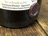 a bottle of wine sitting on a table with a label on it