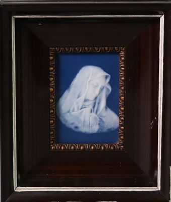 painting of a woman in a white robe in a dark wood frame