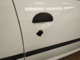 a picture of a white car with a sticker on the door