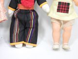 three dolls that are standing next to each other