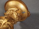 a close up of a gold handle on a table