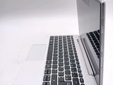 a laptop computer sitting on top of a white table