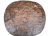 an image of a piece of wood with a face carved into it