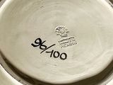 a white plate with a black and white design on it