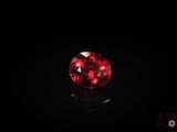 a red diamond on a black surface
