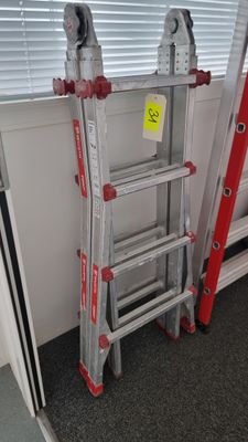 two ladders sitting next to each other in a room