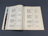 an open book on a table with a menu in it
