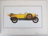an old yellow car is displayed in a frame on a table