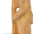 wooden sculpture of a man sitting on a bench with his legs crossed