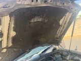 a car that has its hood open with the hood up