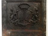 an old metal plaque with a coat of arms and two lions on it