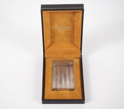 an open box with a cigarette in it on a white surface