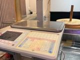 a machine that is sitting on the counter in the kitchen