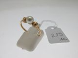 a ring with a pearl on it and a price tag