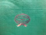 an image of a close up of a green shirt with a logo on it