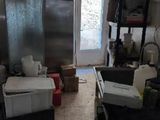 an image of a kitchen with a lot of clutter on the floor