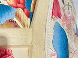 a close up of a chair with a floral pattern on it