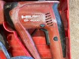 a red box with tools in it on the floor