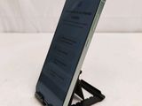 a phone that is sitting on a stand on a table