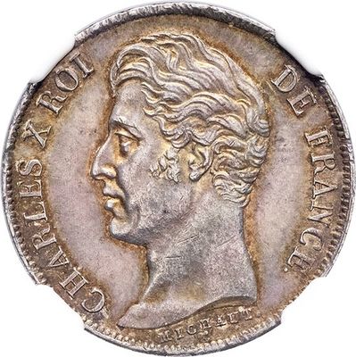 gros plan d'une pièce de monnaie sur laquelle figure un visage de femme
