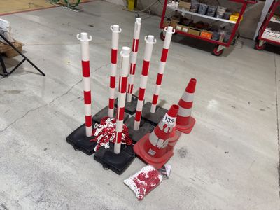 many red and white traffic cones and a fire hydrant in a garage